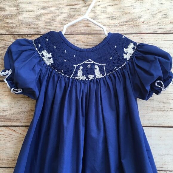 SMOCKED A LOT SMOCKED DRESS WITH EMBROIDERED NATIVITY SCENE - Picture 7 of 7